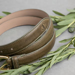 The grain of the Vachetta leather of the Viviana dress belt in olive, up close.