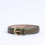 The gold buckle of the Viviana Vachetta dress belt in olive.
