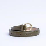 The Viviana dress belt in olive Italian Vachetta leather, coiled.