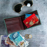 The smooth Vachetta leather of the Zanebono Bifold I wallet in sea green.