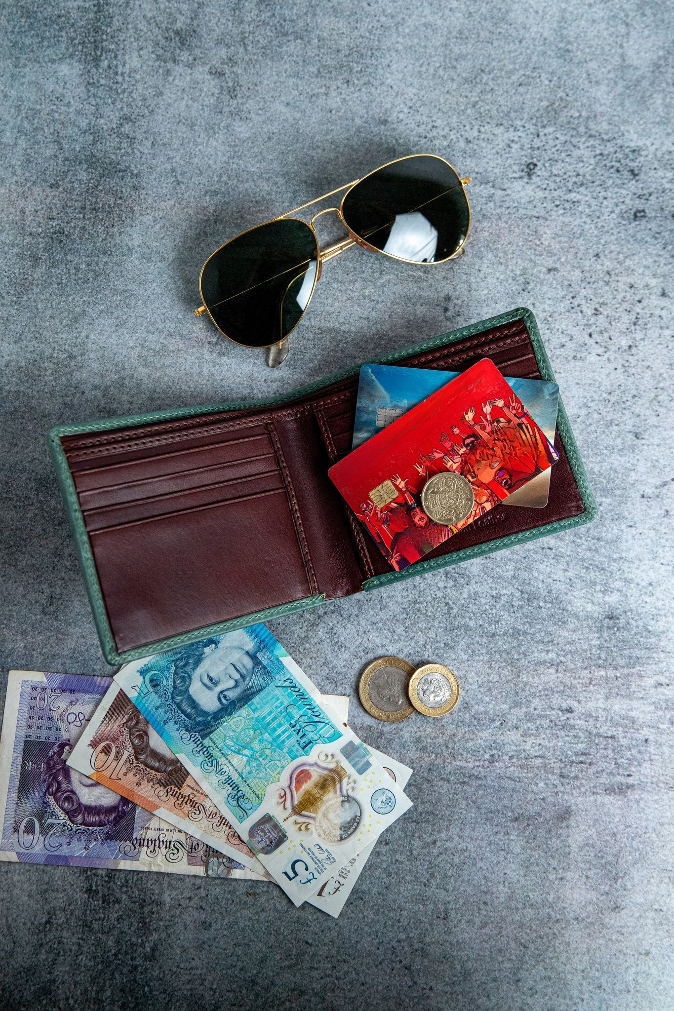 The smooth Vachetta leather of the Zanebono Bifold I wallet in sea green.