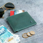 The Zanebono Bifold I wallet in sea green smooth Vachetta leather, composed.