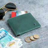 The Zanebono Bifold I wallet in sea green smooth Vachetta leather, composed.