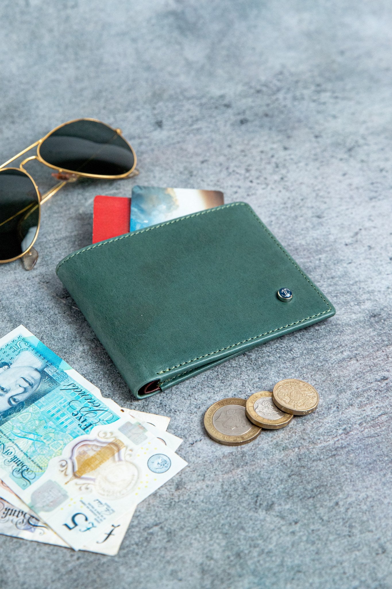 The Zanebono Bifold I wallet in sea green smooth Vachetta leather, composed.