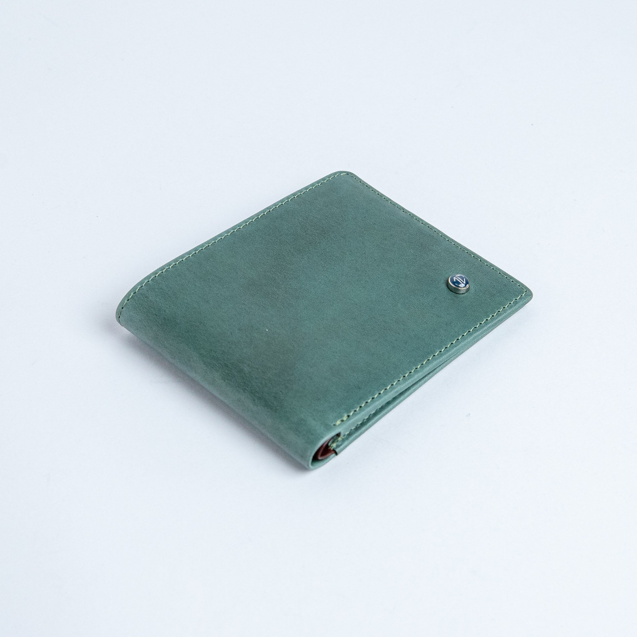 The Zanebono Bifold I wallet in sea green smooth Vachetta leather.
