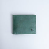 The Zanebono Bifold I wallet in sea green smooth Vachetta leather, closed.