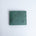 The Zanebono Bifold I wallet in sea green smooth Vachetta leather, closed.