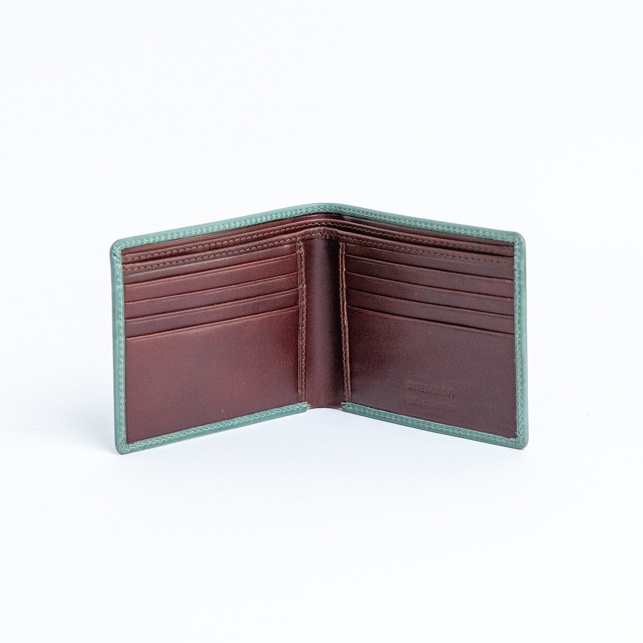 The interior of the Zanebono Bifold I wallet in sea green, showing eight card slots and cash compartments.