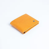 The Zanebono Bifold II wallet in tan smooth Vachetta leather.