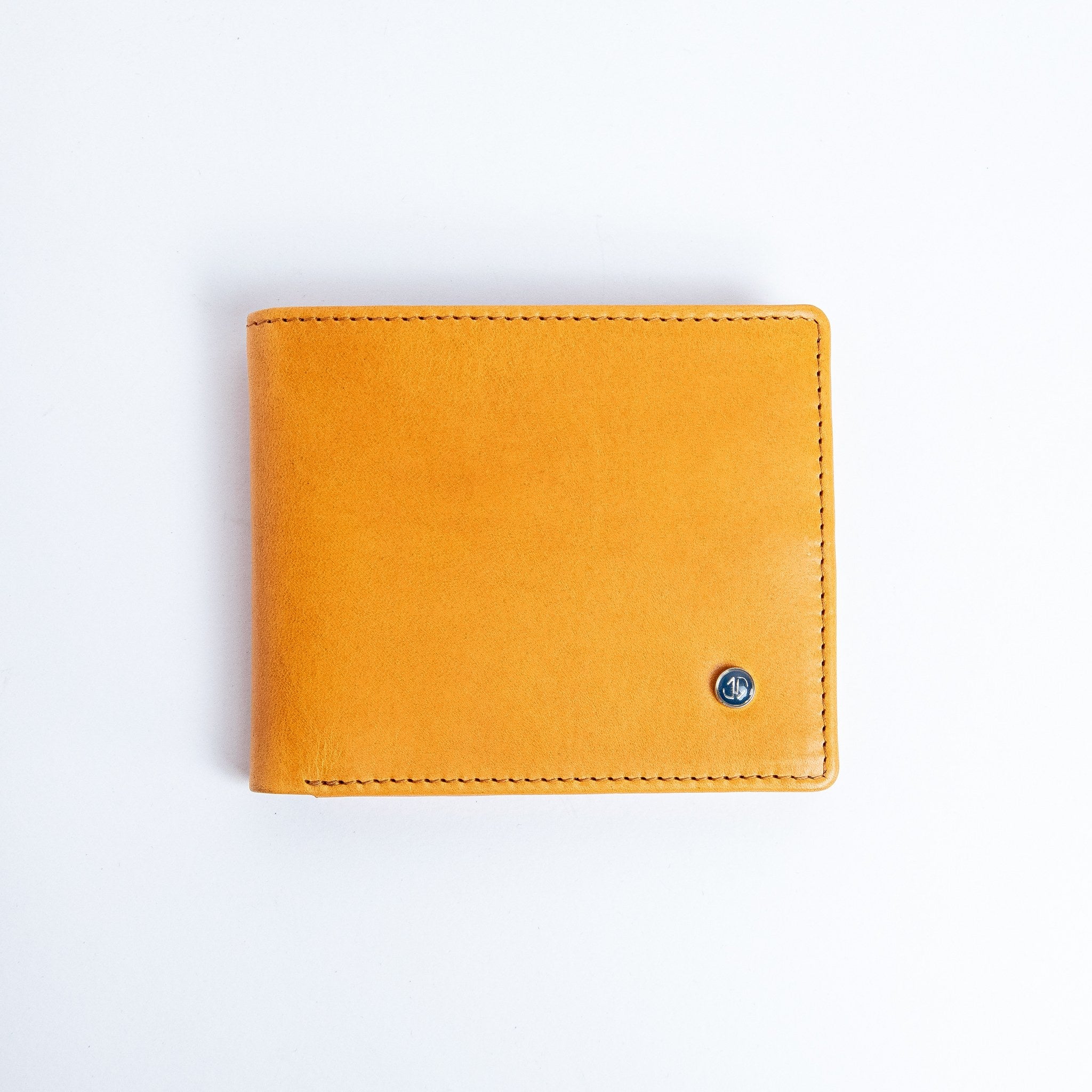 The Zanebono Bifold II wallet in tan smooth Vachetta leather, closed.