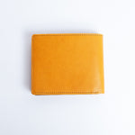 The back of the Zanebono With Flap I wallet in tan smooth Vachetta leather.