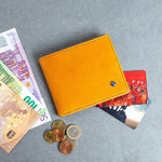 The Zanebono With Flap I wallet in tan, composed.