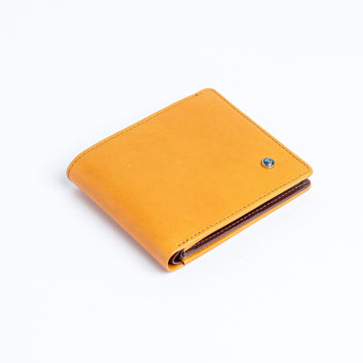 The Zanebono With Flap I wallet in tan smooth Vachetta leather.