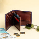 The smooth Vachetta leather of the Zanebono With Flap II wallet in indigo.