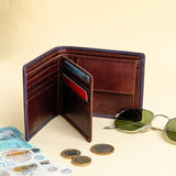 The smooth Vachetta leather of the Zanebono With Flap II wallet in indigo.