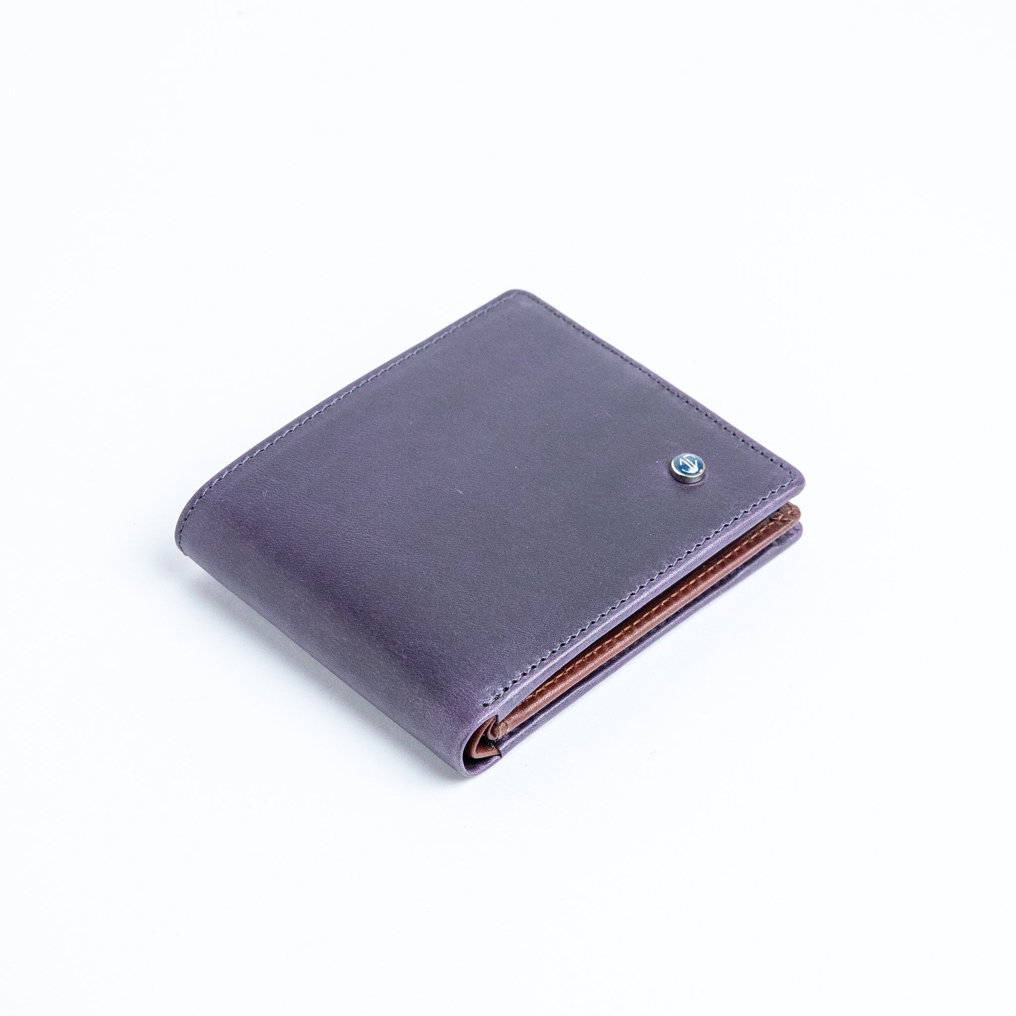 The Zanebono With Flap II wallet in indigo smooth Vachetta leather.