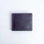 The Zanebono With Flap II wallet in indigo smooth Vachetta leather, closed.