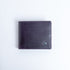 The Zanebono With Flap II wallet in indigo smooth Vachetta leather, closed.