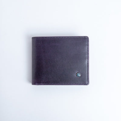 The Zanebono With Flap II wallet in indigo vegetable tanned smooth Vachetta leather, by James Aston